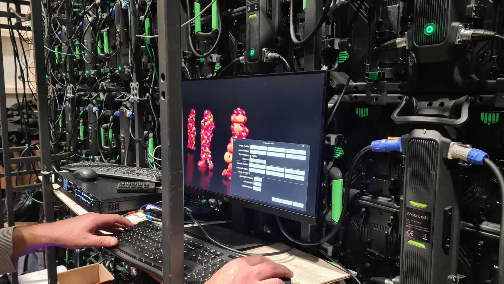 The operator position during the show: live preview on the left, the avatar wall behind it.